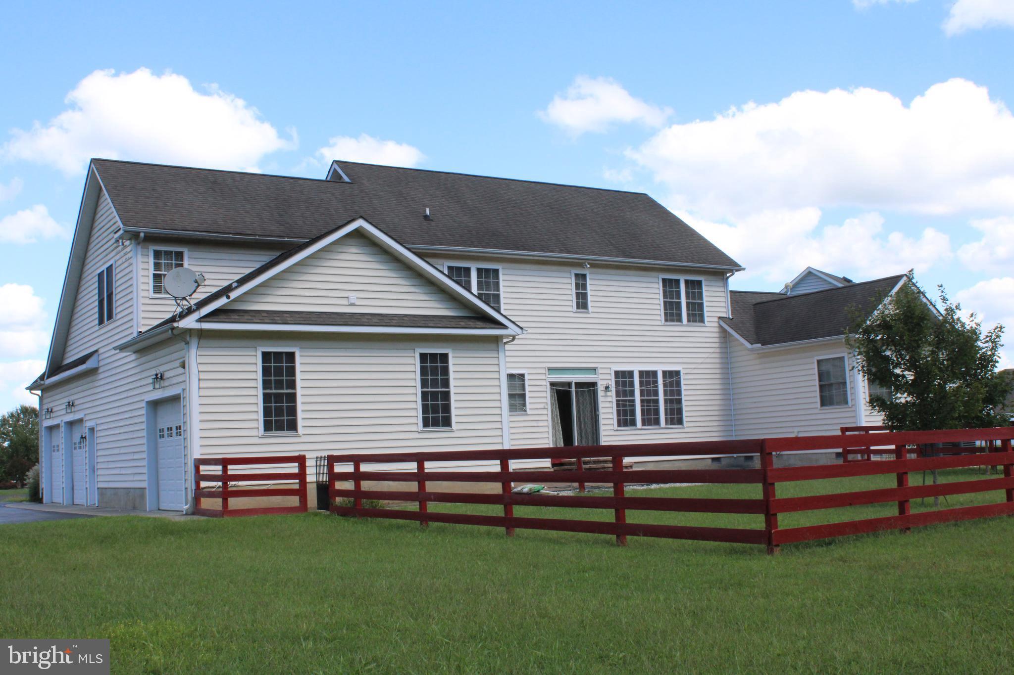 113 Paulowina Road Queen Anne, MD 21657 - Photo 42 of 42 a front view of a house with a yard