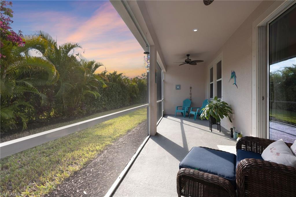 4631 Arboretum Circle, Unit 101 Naples, FL 34112 - Photo 13 of 36 a view of a couches and a table in the balcony