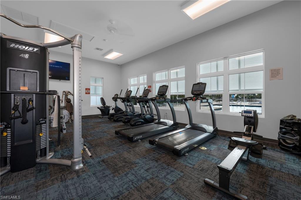 4631 Arboretum Circle, Unit 101 Naples, FL 34112 - Photo 22 of 36 a view of a room with gym equipment