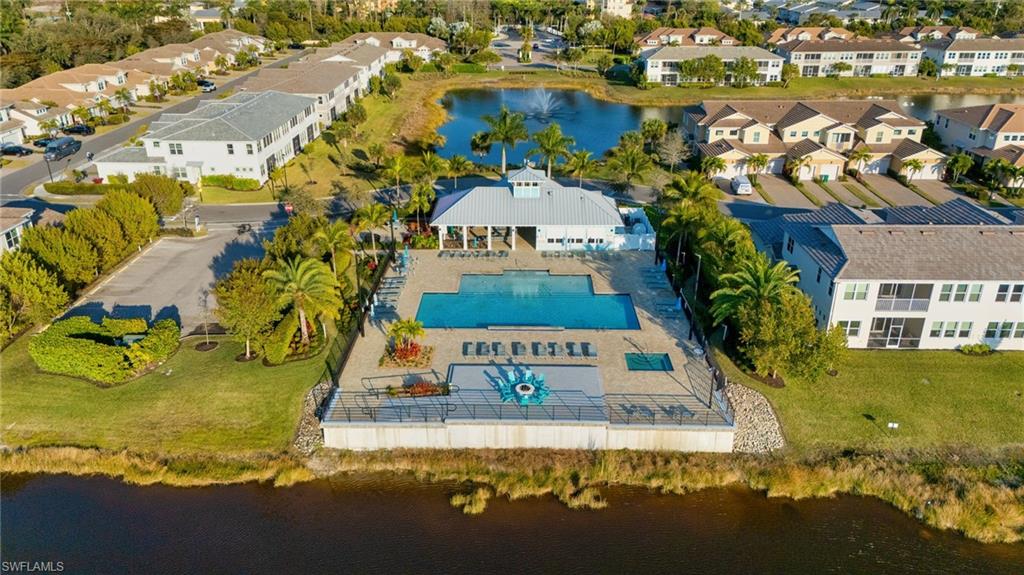 4631 Arboretum Circle, Unit 101 Naples, FL 34112 - Photo 23 of 36 a view of a house with a swimming pool