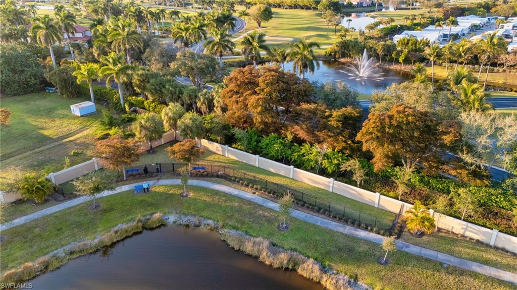 4631 Arboretum Circle, Unit 101 Naples, FL 34112 - Photo 25 of 36 a view of a yard with an outdoor space