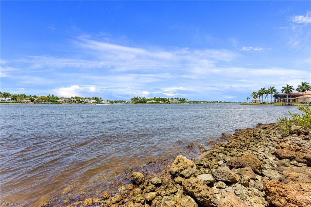 4631 Arboretum Circle, Unit 101 Naples, FL 34112 - Photo 30 of 36 a view of an ocean and beach