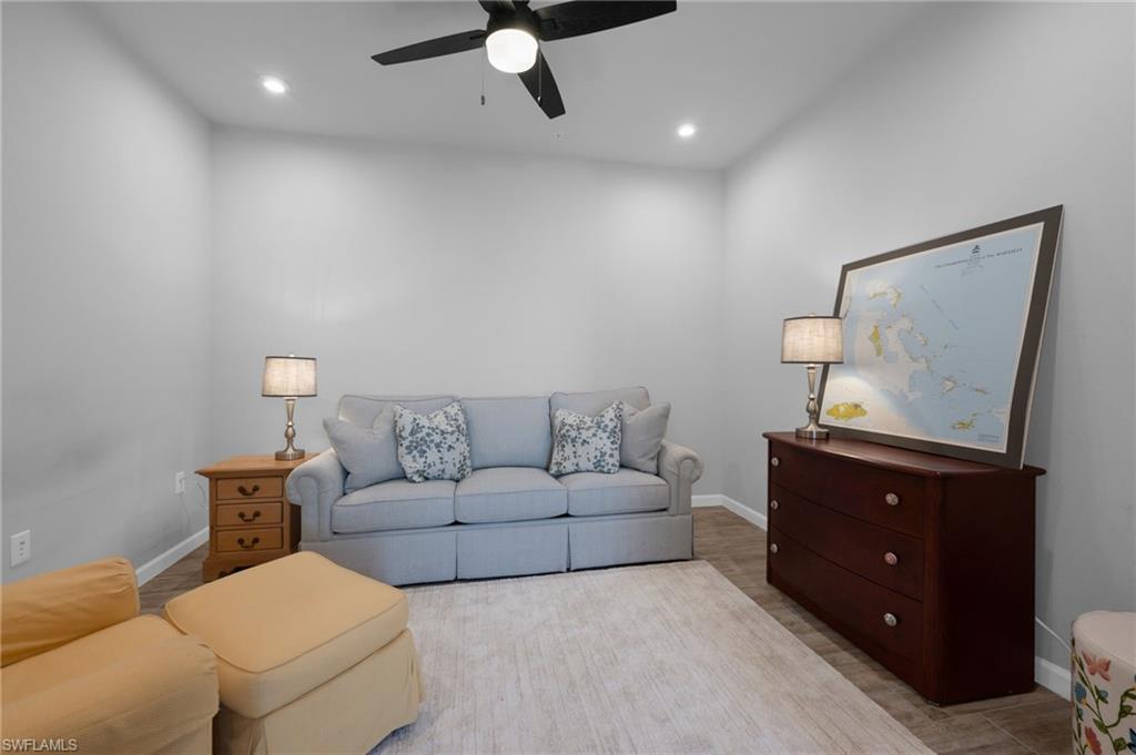 4631 Arboretum Circle, Unit 101 Naples, FL 34112 - Photo 8 of 36 a living room with furniture