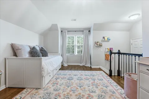 a bathroom with a toilet and a shower curtain