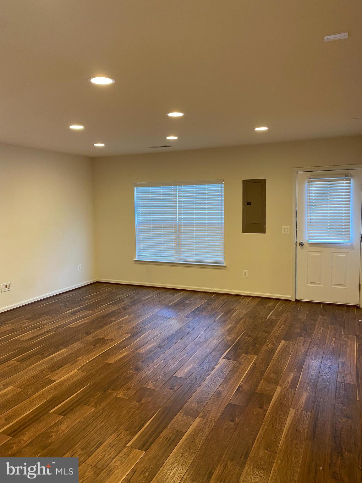 Rec room With laminate wood flooring