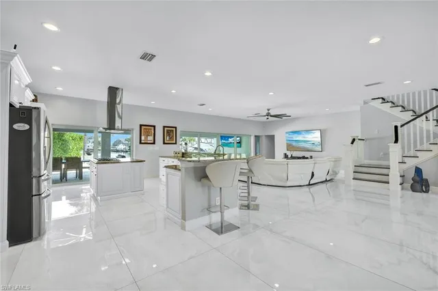 a view of a living room and kitchen
