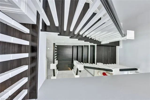 a view of an empty room with stairs