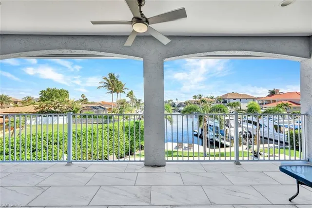 a view of a porch with a floor to ceiling window stairs and a table