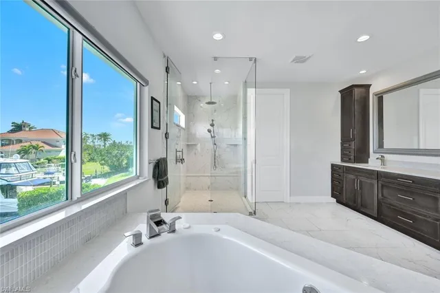 a bathroom with a bathtub and a sink