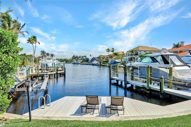 a view of a swimming pool with outdoor seating