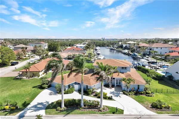 an aerial view of residential houses with outdoor space