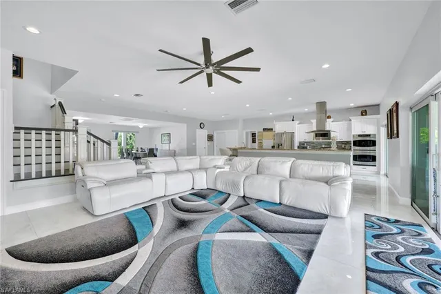 a living room with furniture and a rug