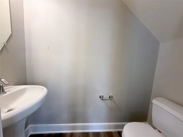a bathroom with a toilet and a sink