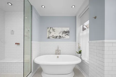 a bedroom with a bed and a mirror