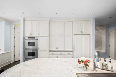 a bedroom with a bed and a cabinet