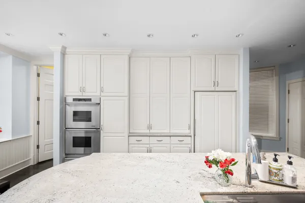 a bedroom with a bed and a cabinet