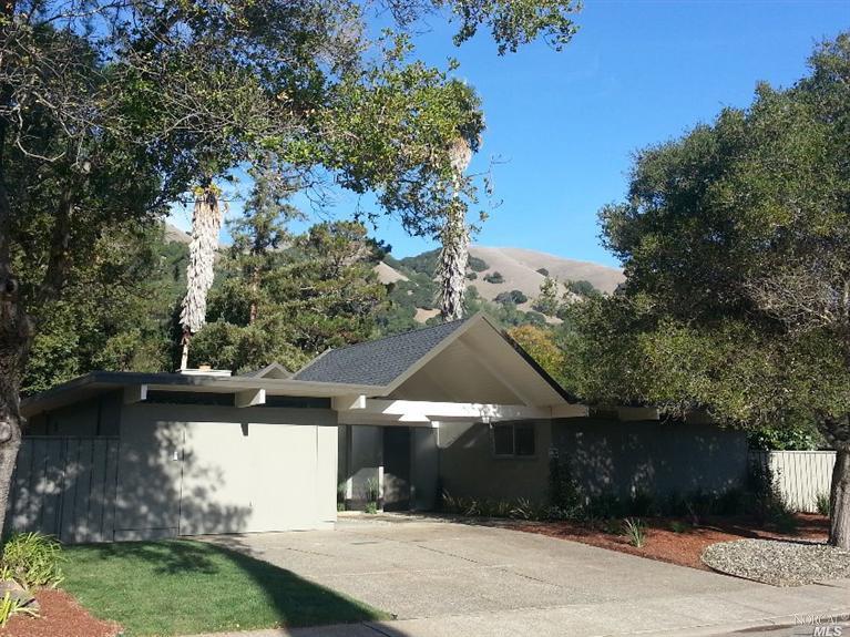 a backyard of a house with lots of green space