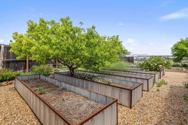 a view of a backyard with sitting area