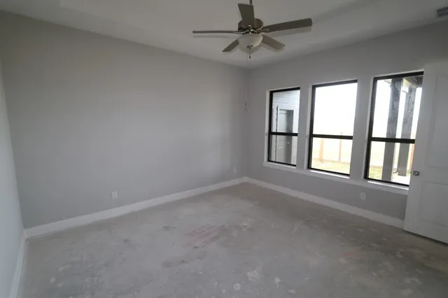 an empty room with windows