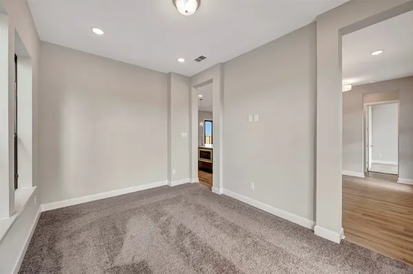 a kitchen with stainless steel appliances granite countertop a sink a stove and a wooden floors