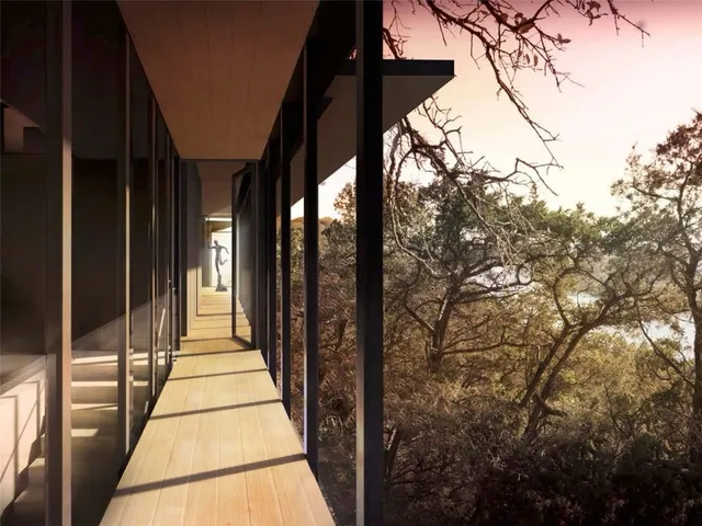 a view of balcony with wooden floor and fence