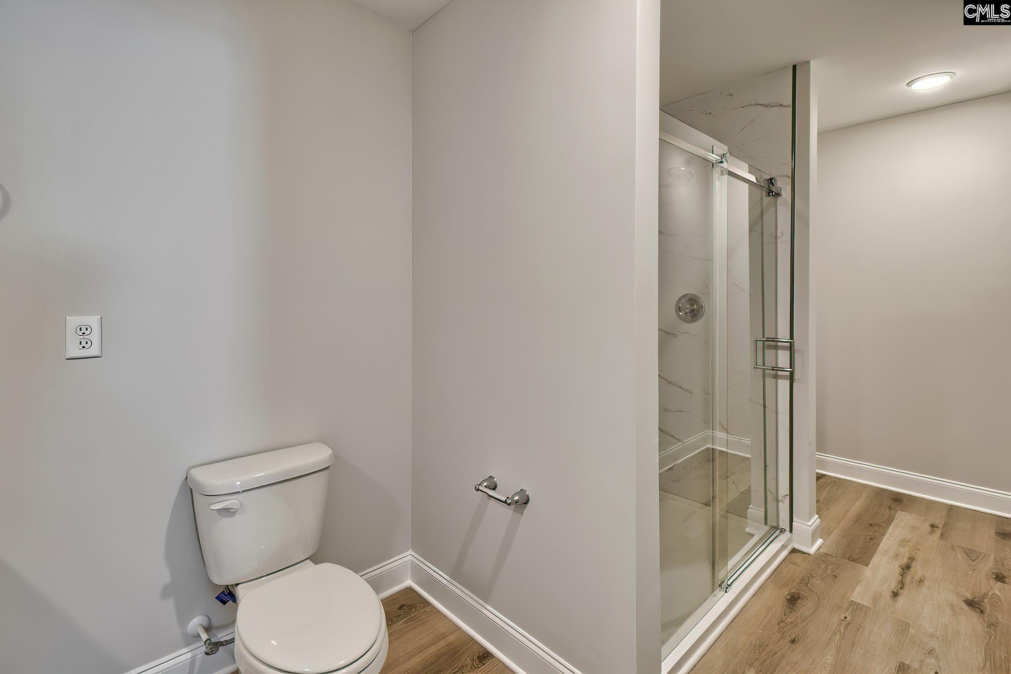 259 Eastover Road Eastover, SC 29044 - Photo 7 of 16 a white toilet sitting next to a shower