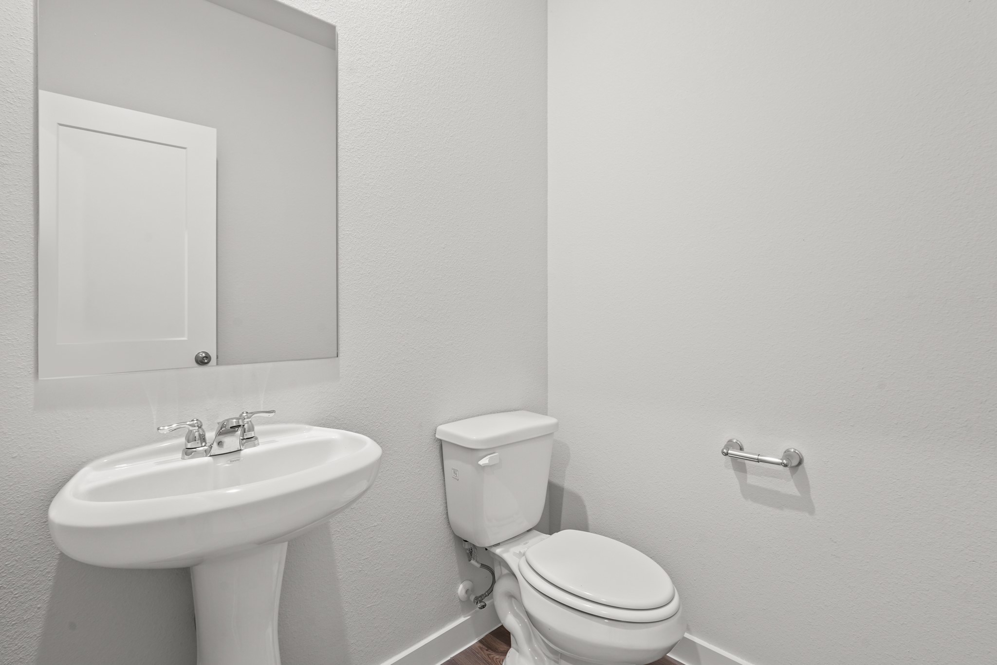 9720 Caney Bend Road Conroe, TX 77303 - Photo 17 of 24 a bathroom with a sink a toilet and a mirror
