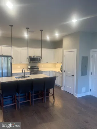 a kitchen with a table and chairs in it