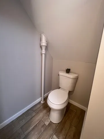 a white toilet sitting next to a sink
