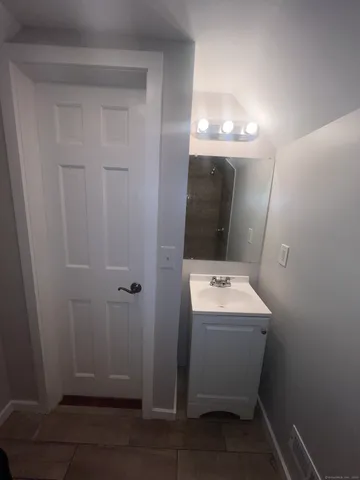 a bathroom with a sink and mirror