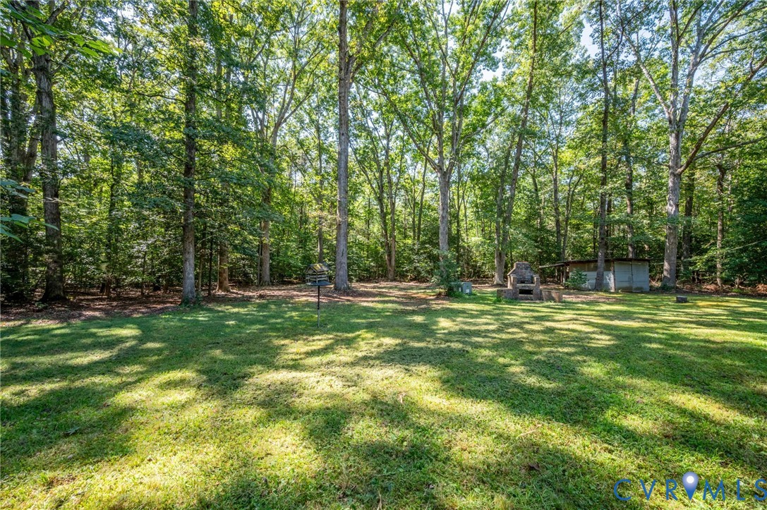 2409 Three Bridge Road Powhatan, VA 23139 - Photo 38 of 39 Expansive grassy area surrounded by mature trees,