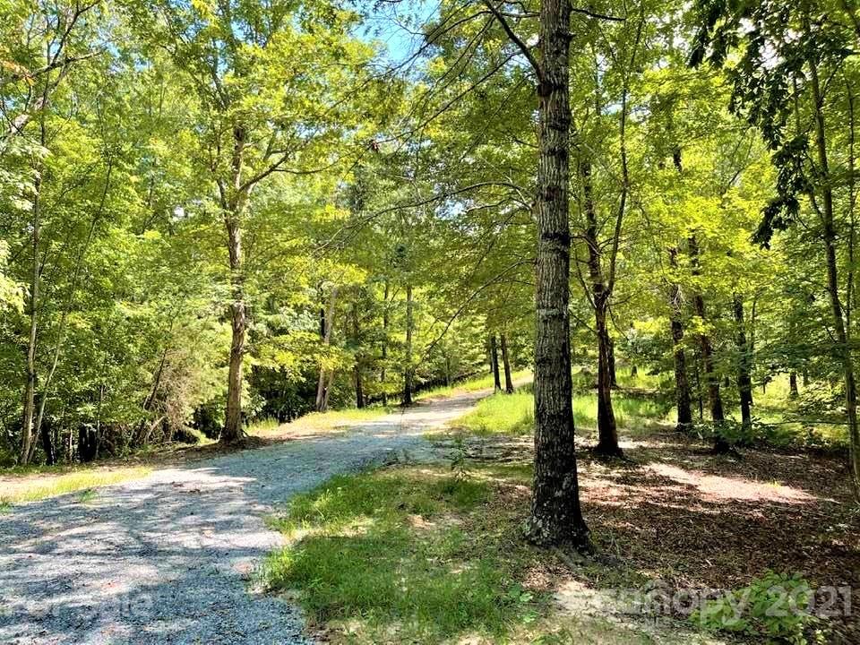 0 North Highland Road, Unit 6 Mill Spring, NC 28756 - Photo 2 of 14 a view of a large yard with lots of green space