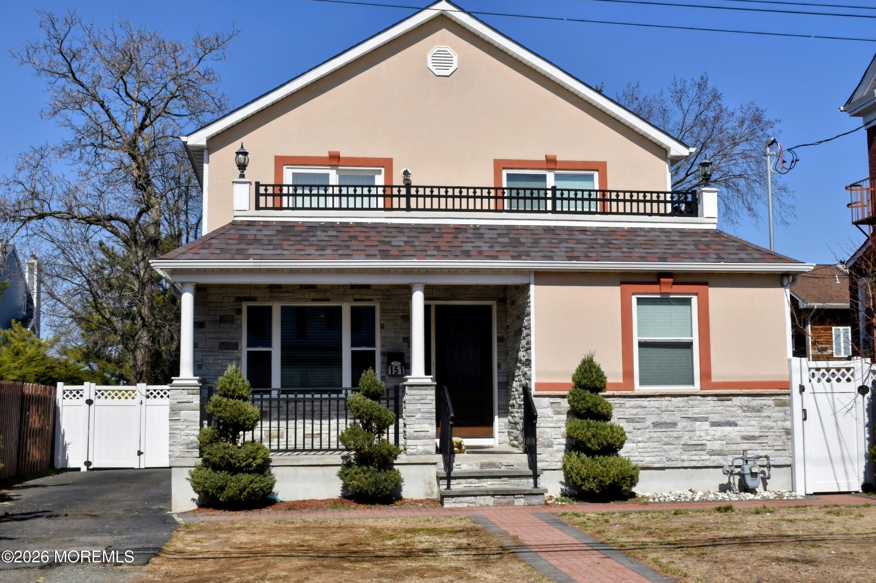 151 1st Street Keyport, NJ 07735 - Photo 1 of 24 a front view of a house with a yard