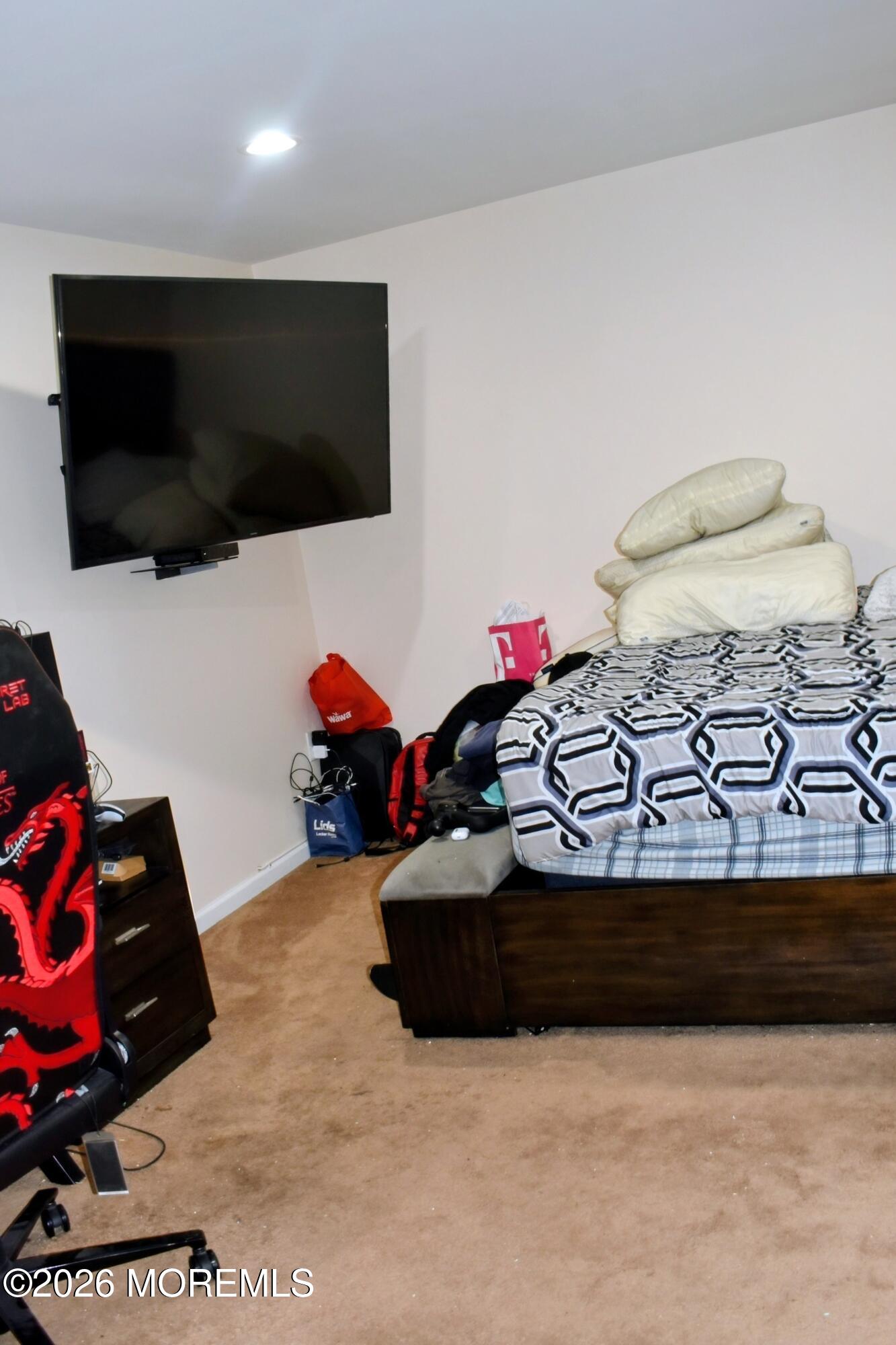 151 1st Street Keyport, NJ 07735 - Photo 15 of 24 a living room with furniture a flat screen tv and gym equipment