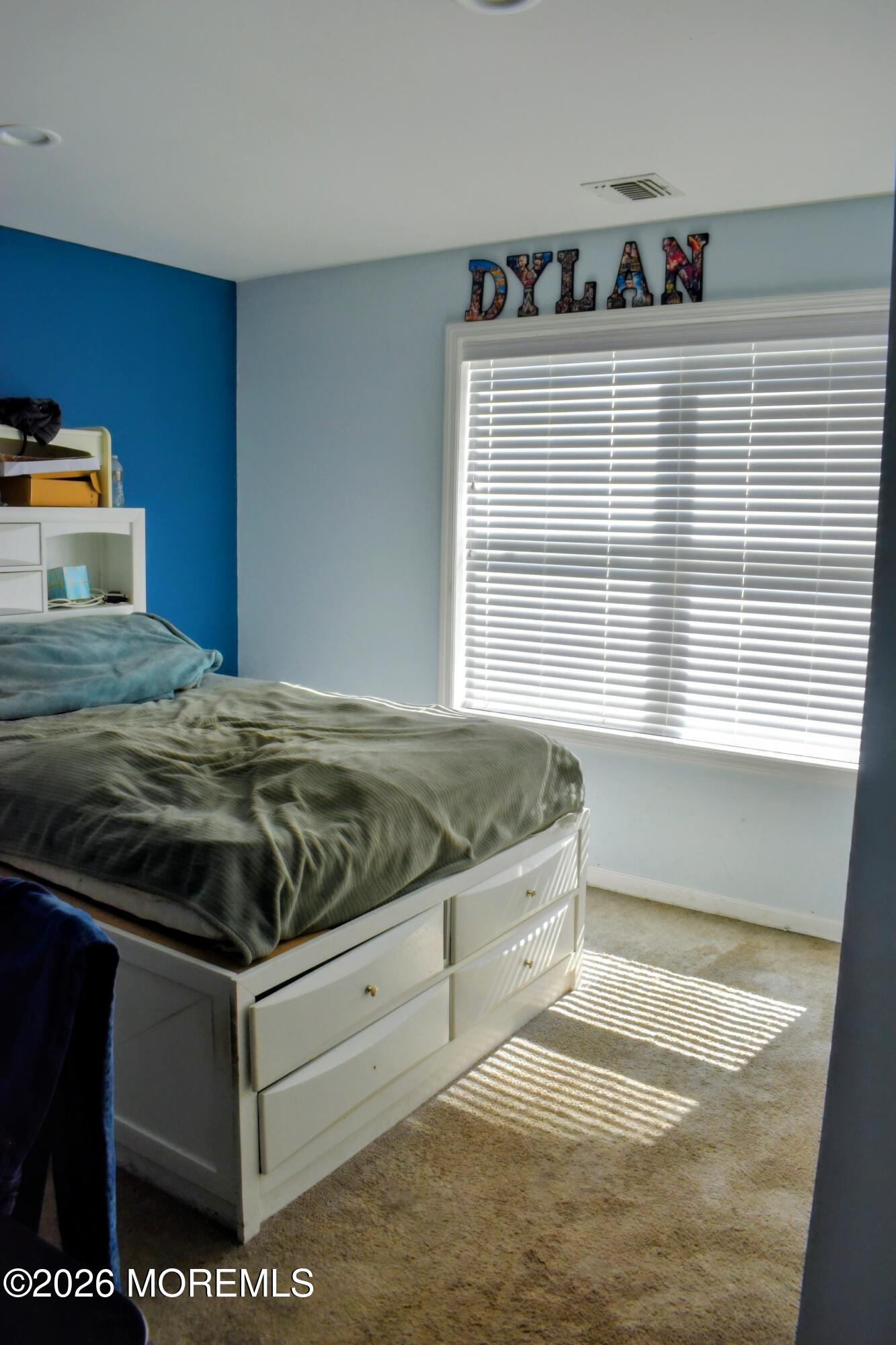151 1st Street Keyport, NJ 07735 - Photo 19 of 24 a bed sitting in a bedroom next to a window