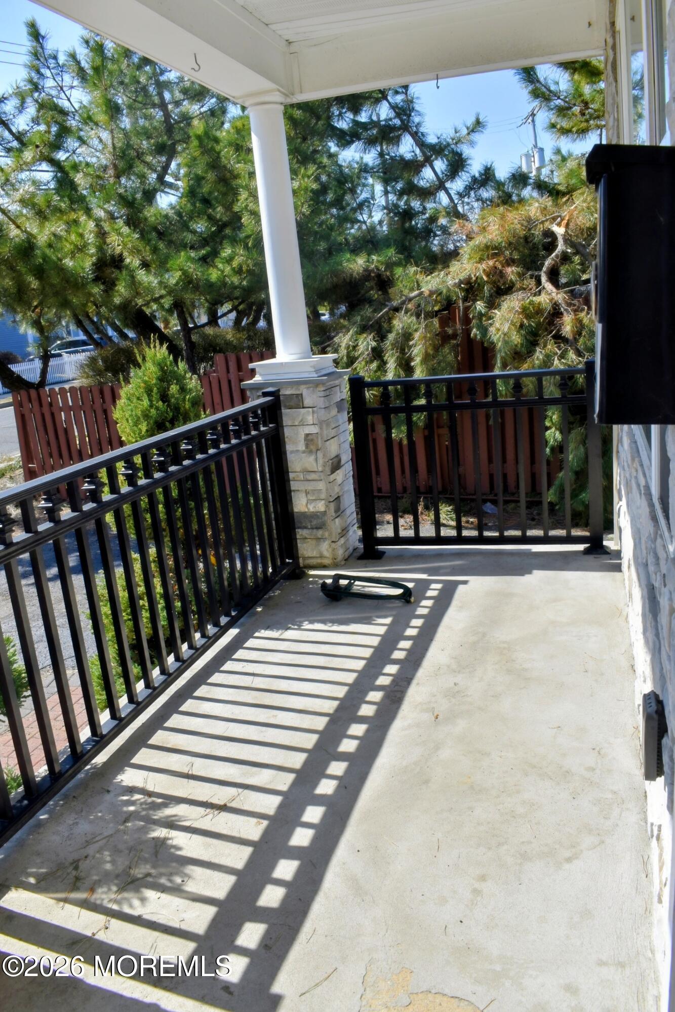 151 1st Street Keyport, NJ 07735 - Photo 3 of 24 a view of balcony with wooden floor and fence