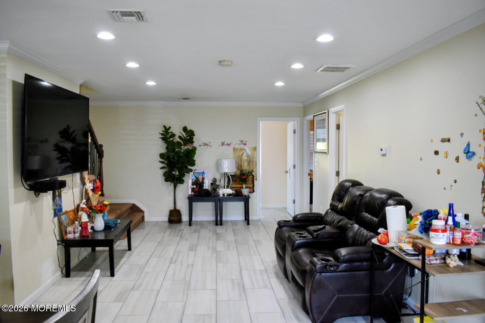 151 1st Street Keyport, NJ 07735 - Photo 4 of 24 a living room with furniture and a flat screen tv