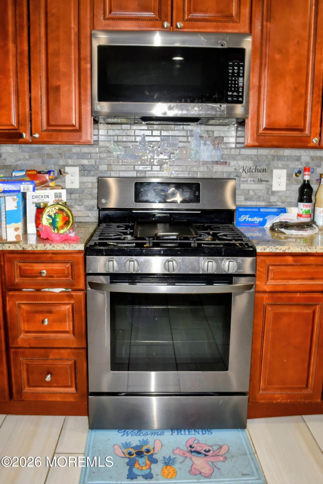 151 1st Street Keyport, NJ 07735 - Photo 6 of 24 a stove top oven sitting inside of a kitchen