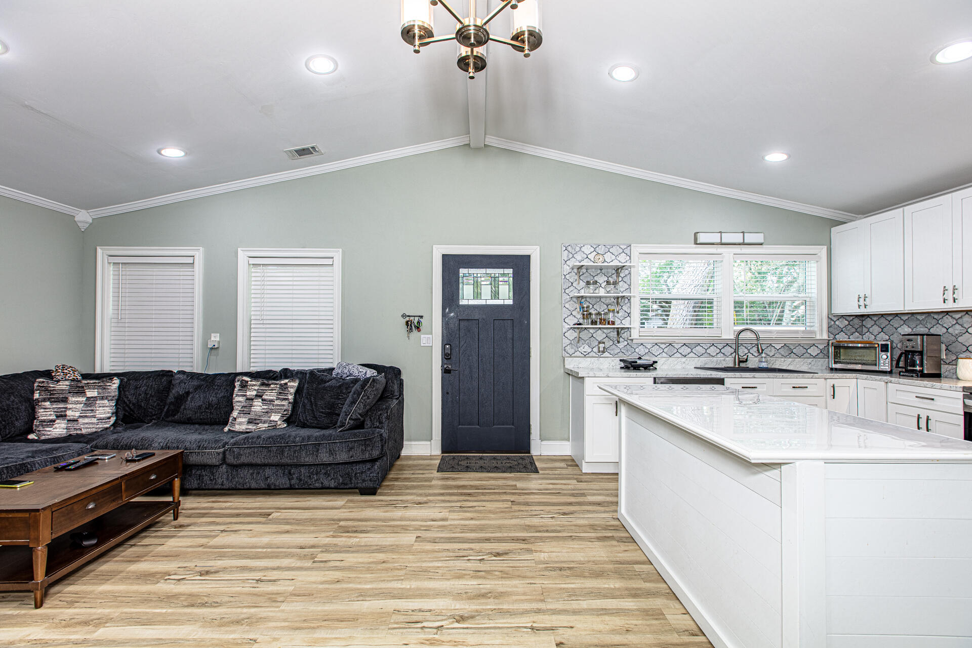 1013 Gloria Avenue Fort Walton Beach, FL 32547 - Photo 11 of 31 a living room with furniture and a chandelier