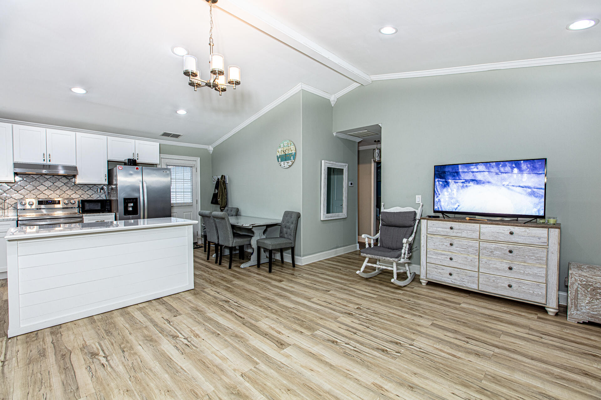 1013 Gloria Avenue Fort Walton Beach, FL 32547 - Photo 15 of 31 a room with furniture and a flat screen tv