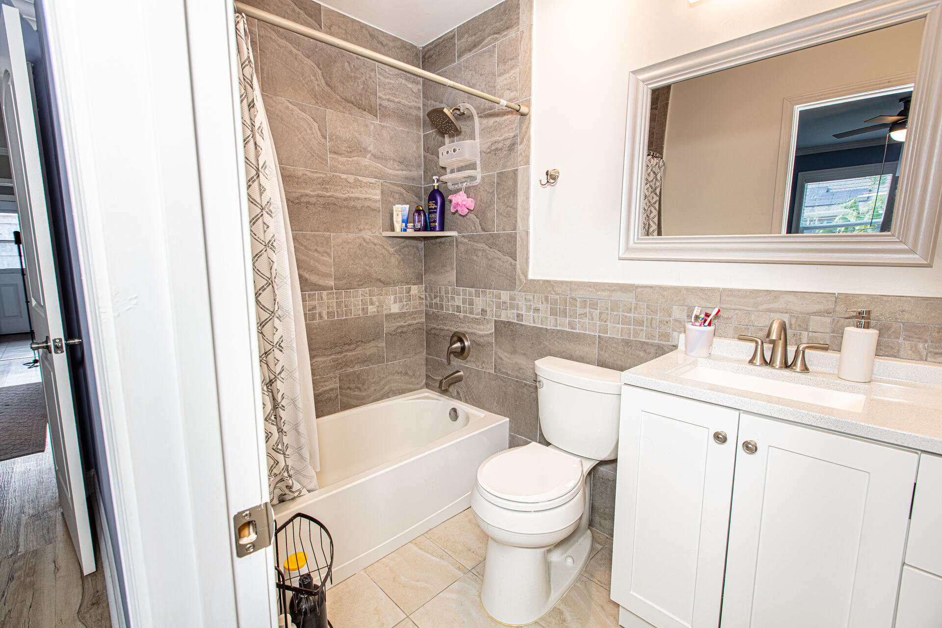 1013 Gloria Avenue Fort Walton Beach, FL 32547 - Photo 23 of 31 a bathroom with a sink a toilet and shower