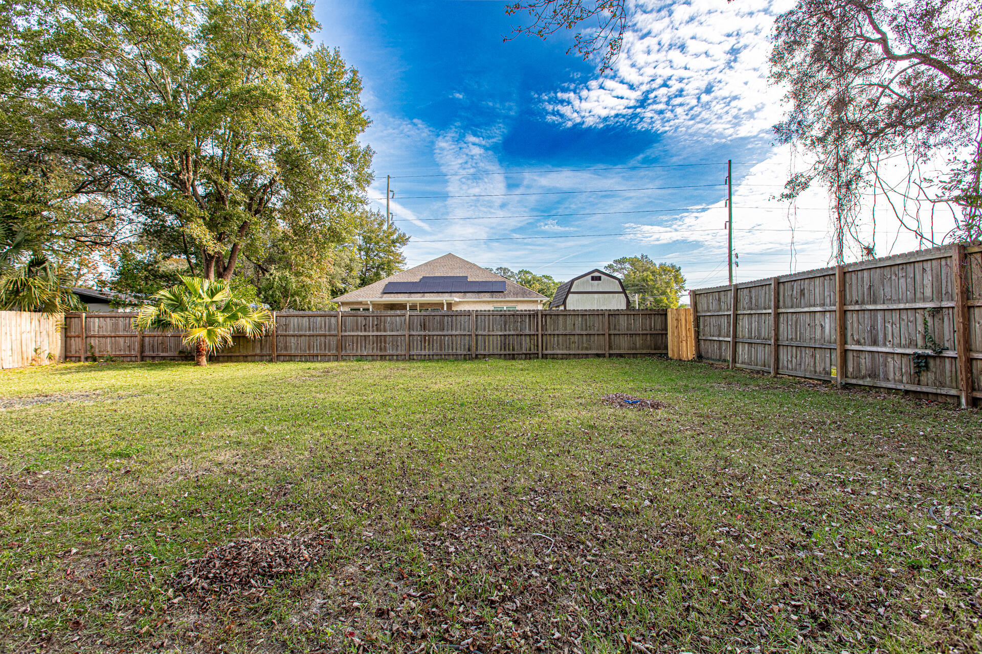 1013 Gloria Avenue Fort Walton Beach, FL 32547 - Photo 10 of 31 a view of outdoor space with deck and tree