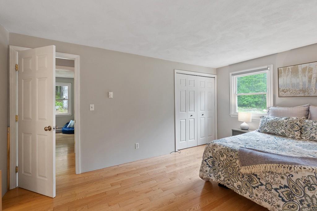 684 Burroughs Road Boxborough, MA 01719 - Photo 18 of 30 a bedroom with a bed and a window