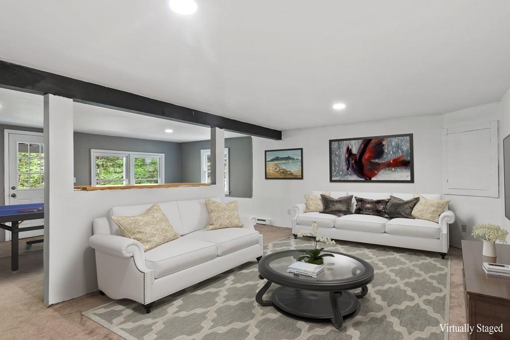 684 Burroughs Road Boxborough, MA 01719 - Photo 23 of 30 a living room with furniture a rug and a window