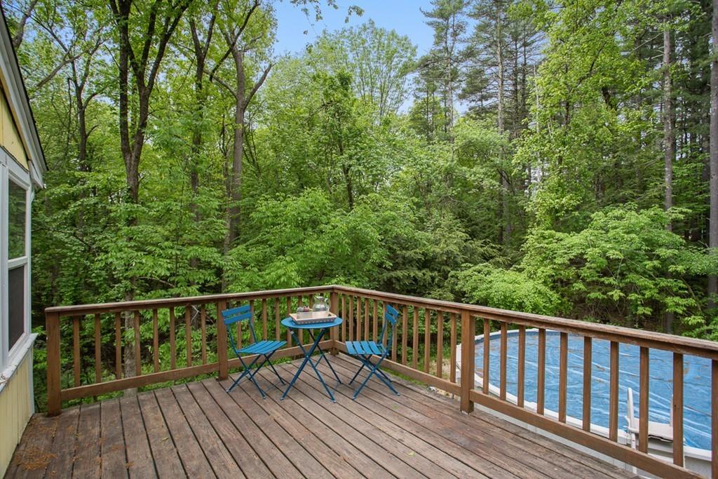 684 Burroughs Road Boxborough, MA 01719 - Photo 27 of 30 a view of a wooden deck with trees