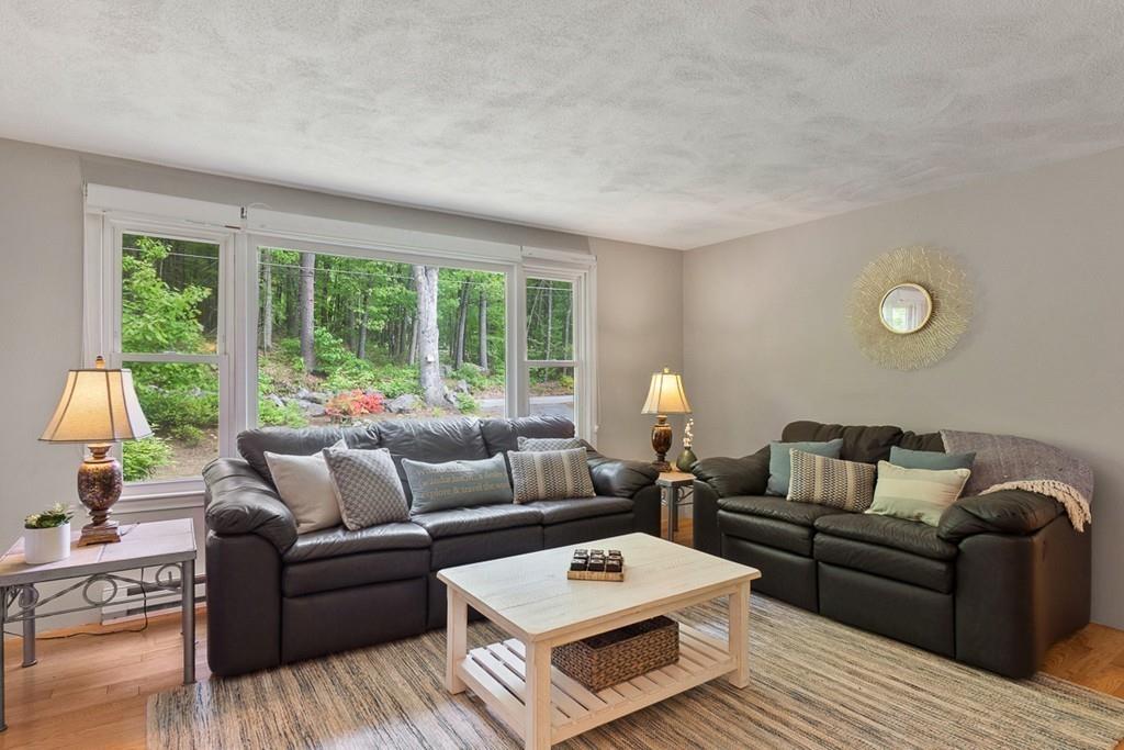 684 Burroughs Road Boxborough, MA 01719 - Photo 5 of 30 a living room with furniture and a large window
