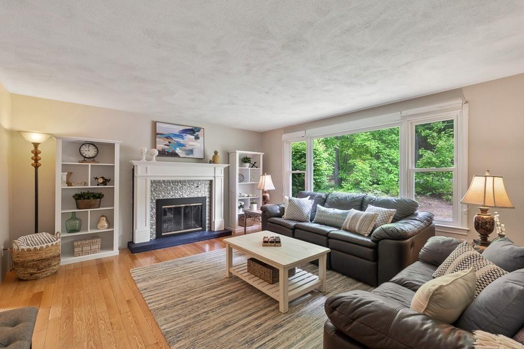 684 Burroughs Road Boxborough, MA 01719 - Photo 6 of 30 a living room with furniture and a fireplace