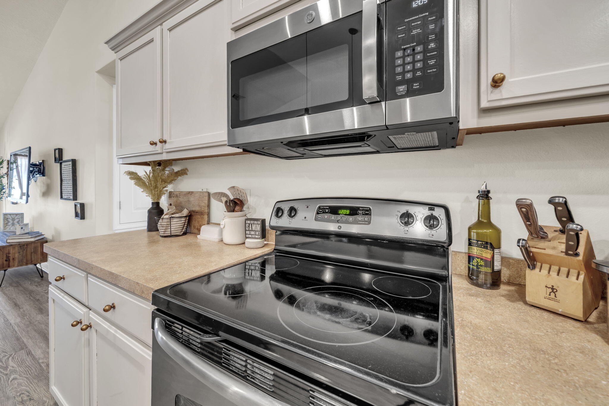 217 Raptor Drive Crestview, FL 32536 - Photo 19 of 48 a kitchen with wooden cabinets and a stove top oven
