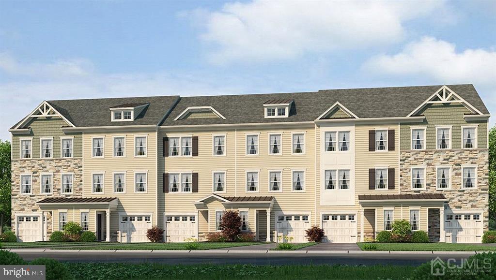 a front view of residential houses with yard