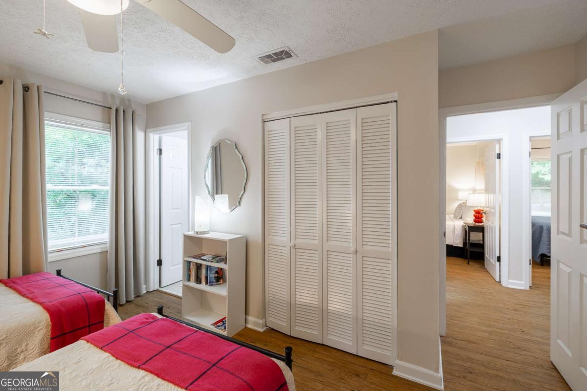 168 Pearl Street Athens, GA 30601 - Photo 23 of 43 a bedroom with furniture and a fireplace